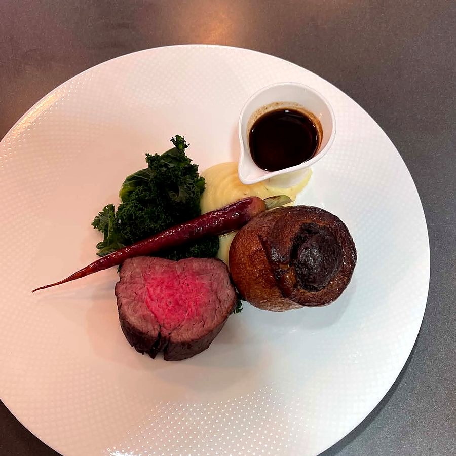 Beef fillet with Yorkshire pudding, kale, heritage carrot, mash and jus